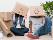 Couple having fun while moving home